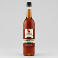 Bottle of Red Elk Bourbon Style Dry Ginger Ale on a gray background