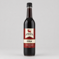 Bottle of Red Elk Cola syrup on a gray background