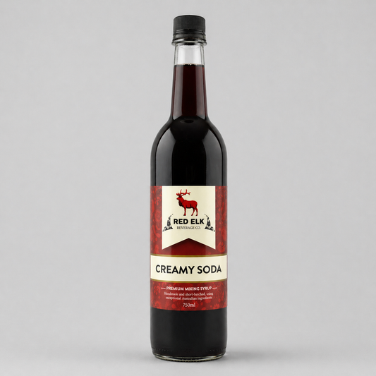 Bottle of Red Elk Creamy Soda on a gray background