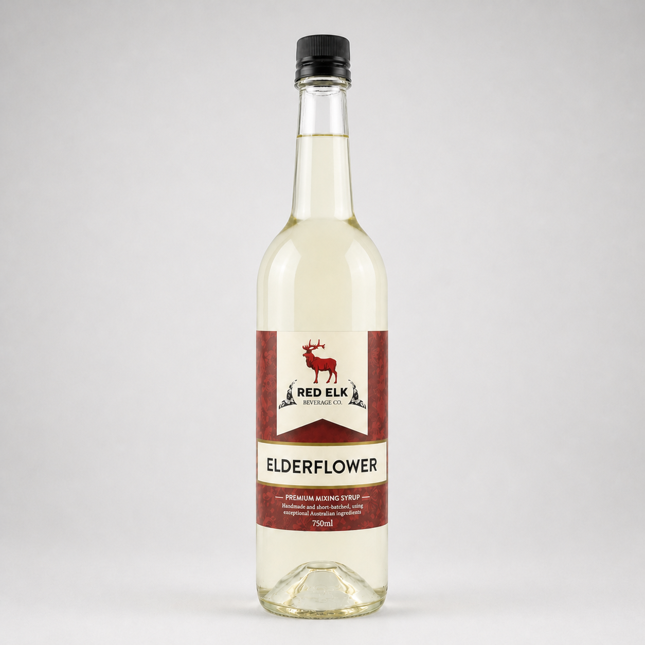 Bottle of Red Elk Elderflower syrup on a white background