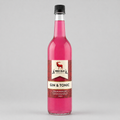 Bottle of Red Elk Gin & Tonic syrup on a gray background