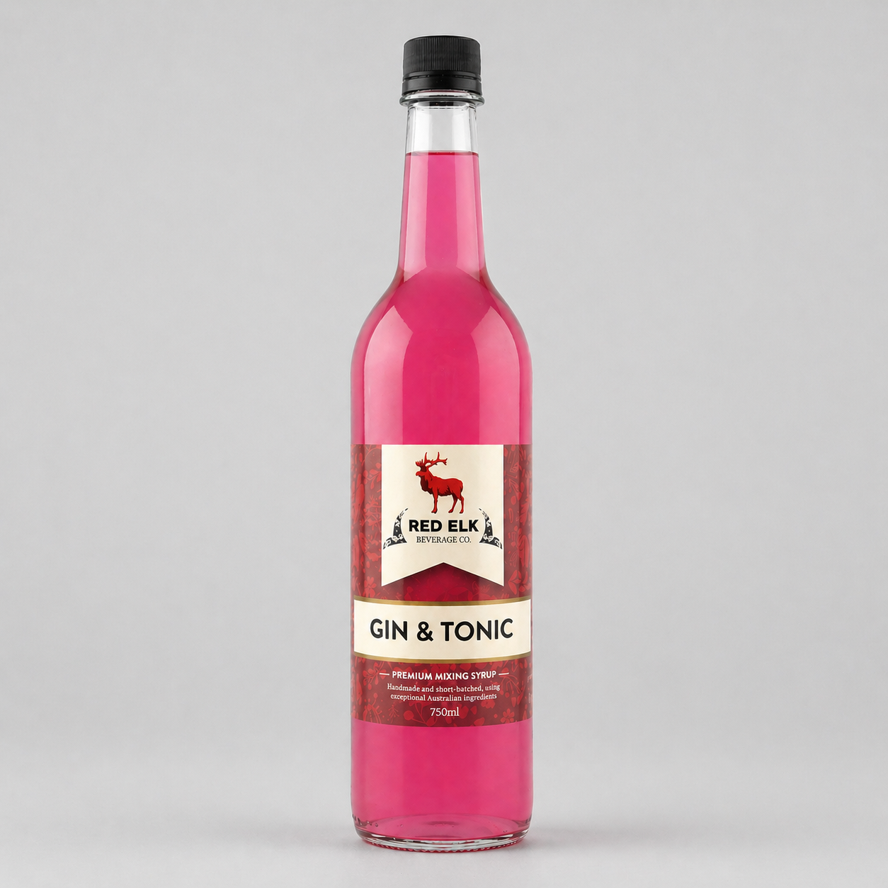 Bottle of Red Elk Gin & Tonic syrup on a gray background