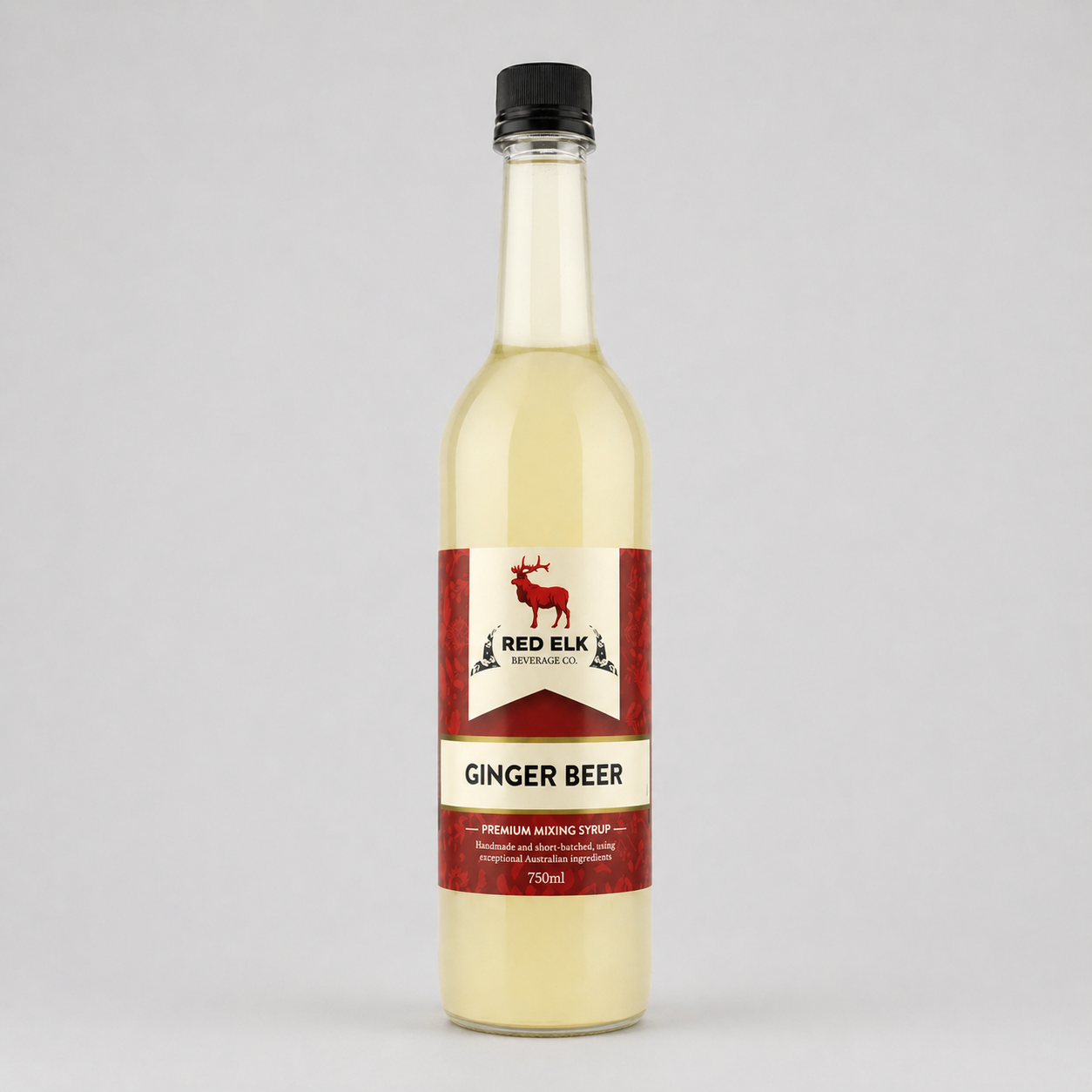 Bottle of Red Elk Ginger Beer syrup on a gray background