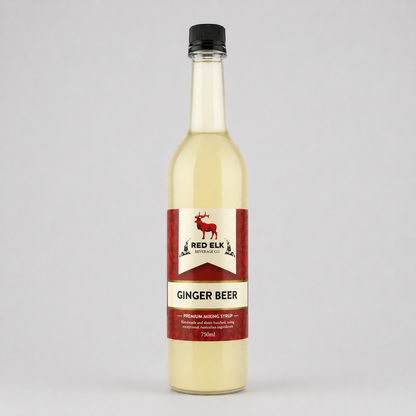 Bottle of Red Elk Ginger Beer syrup on a gray background