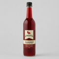 Bottle of Red Elk Gluhwein syrup on a gray background