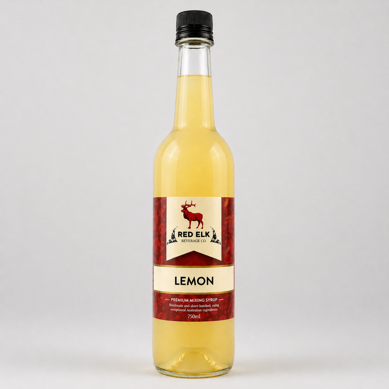 Bottle of lemon syrup with a Red Elk Beverage Co label on a white background