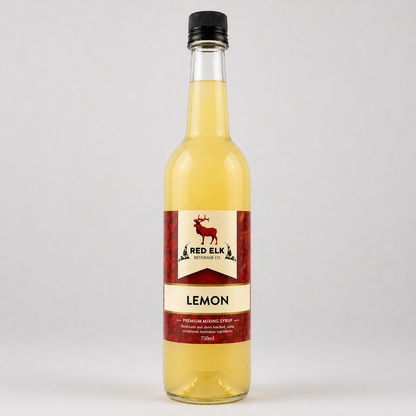 Bottle of lemon syrup with a Red Elk Beverage Co label on a white background