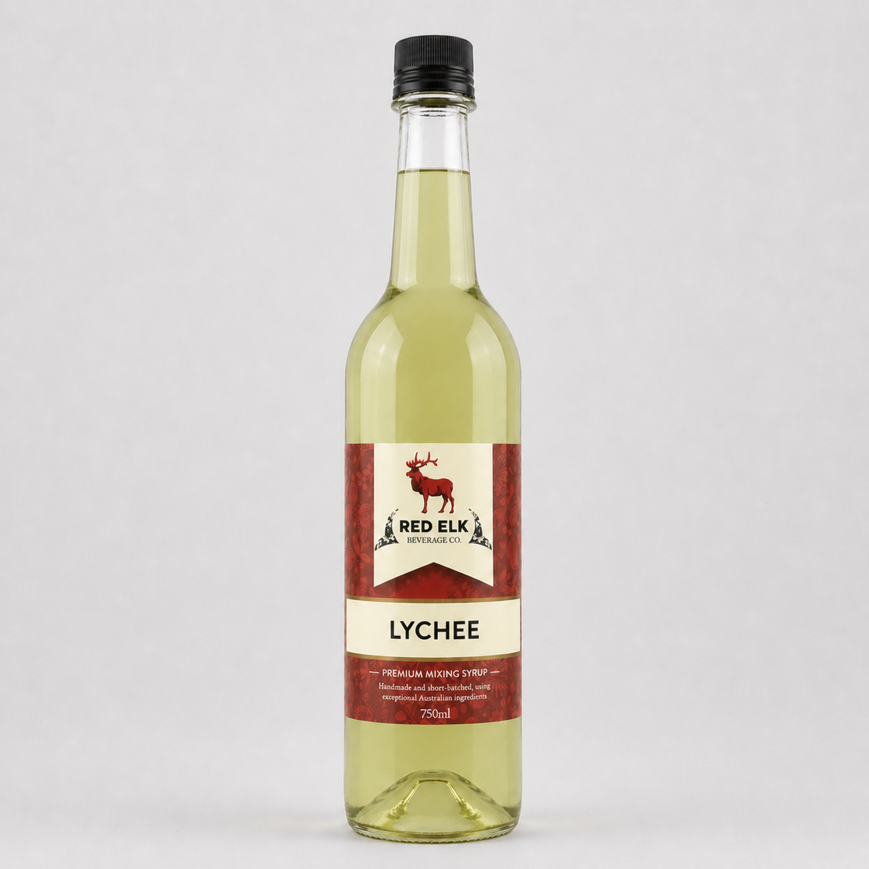 Bottle of Red Elk Lychee syrup on a light gray background