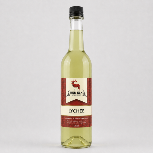 Bottle of Red Elk Lychee syrup on a light gray background