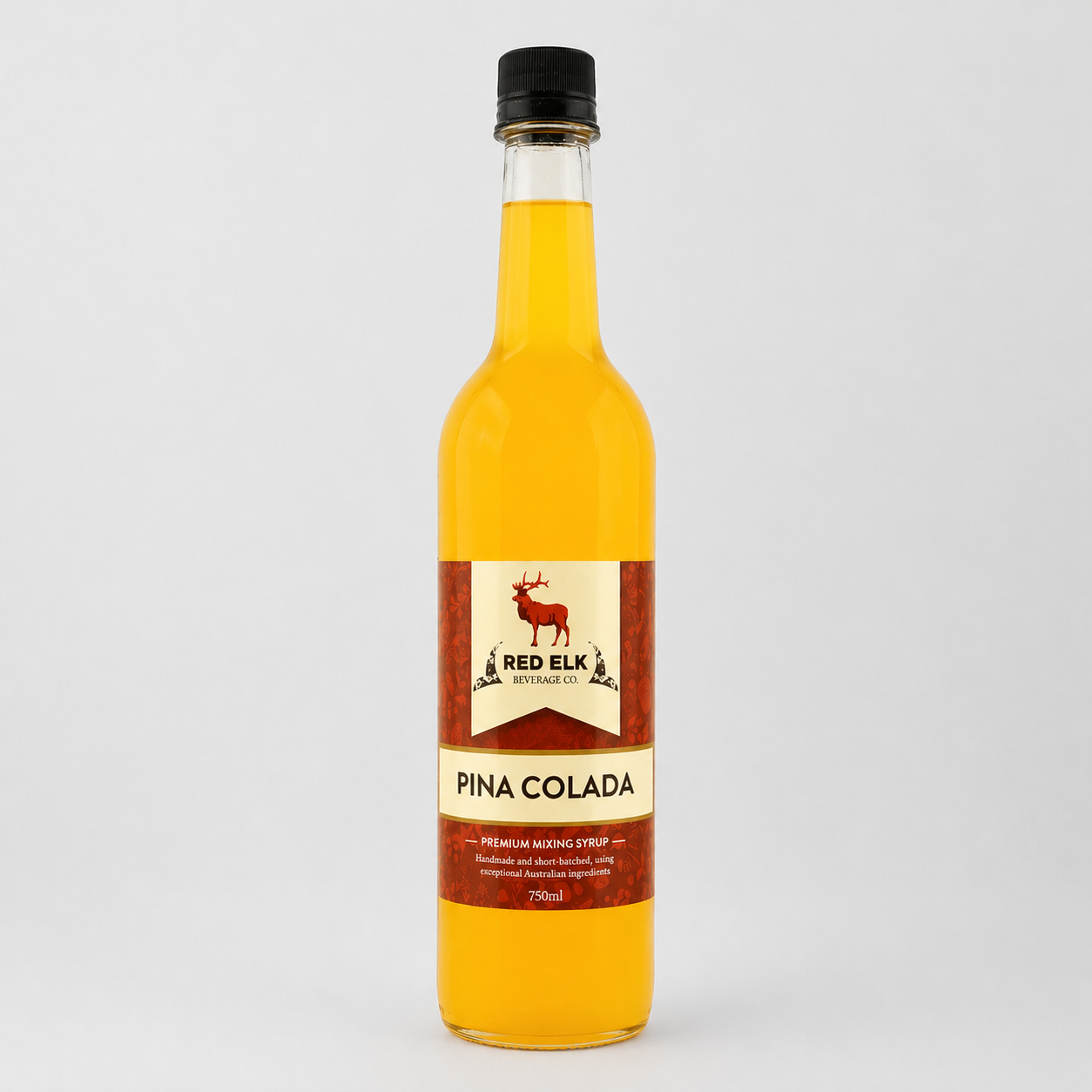 Bottle of Red Elk Pina Colada syrup on a white background