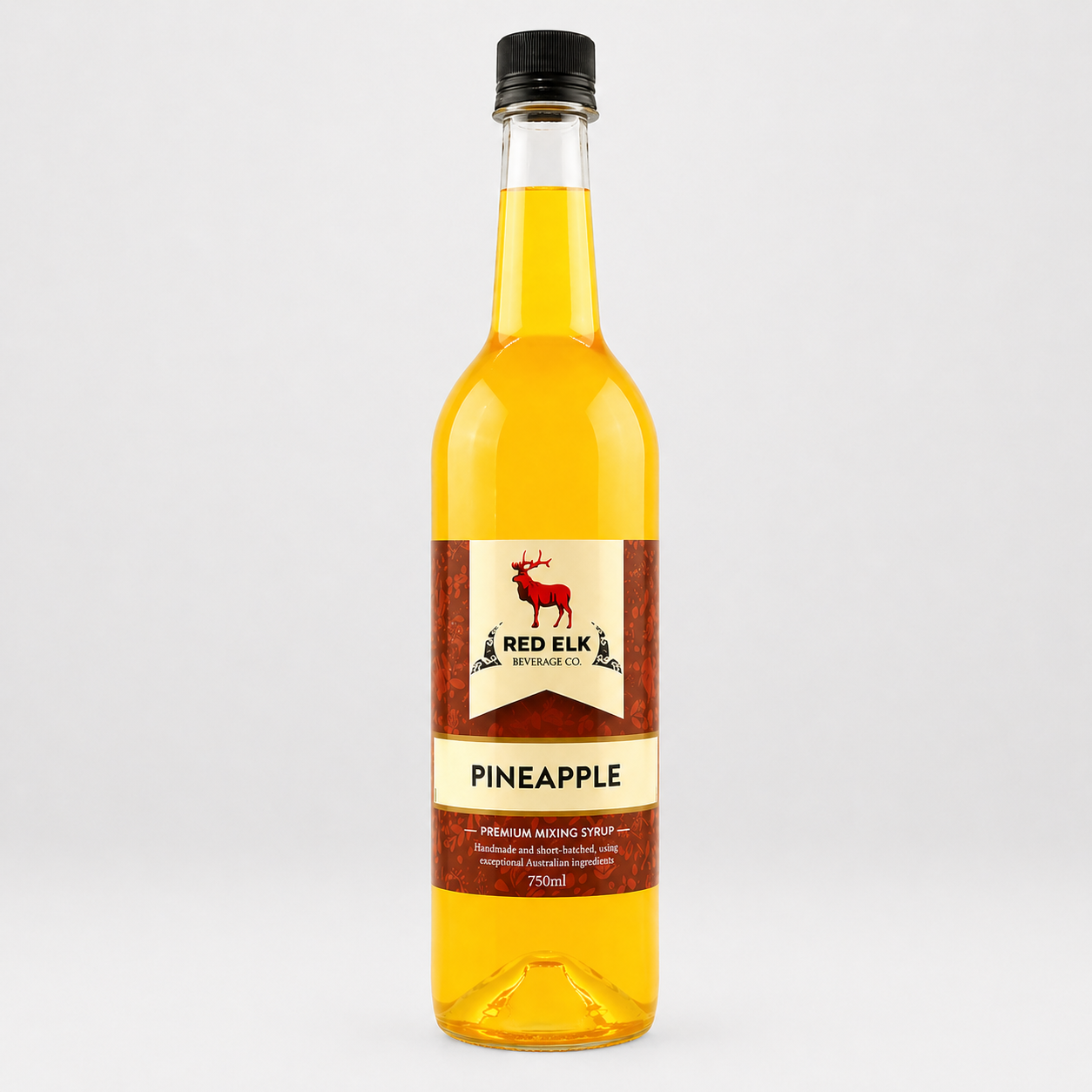 Bottle of Red Elk Pineapple syrup on a white background