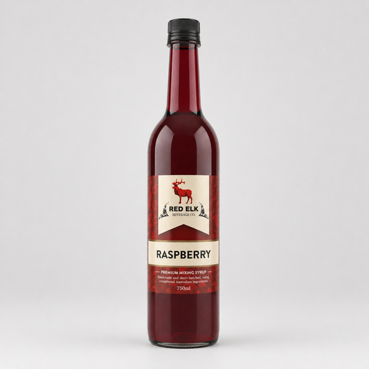 Bottle of Red Elk Raspberry syrup on a light gray background