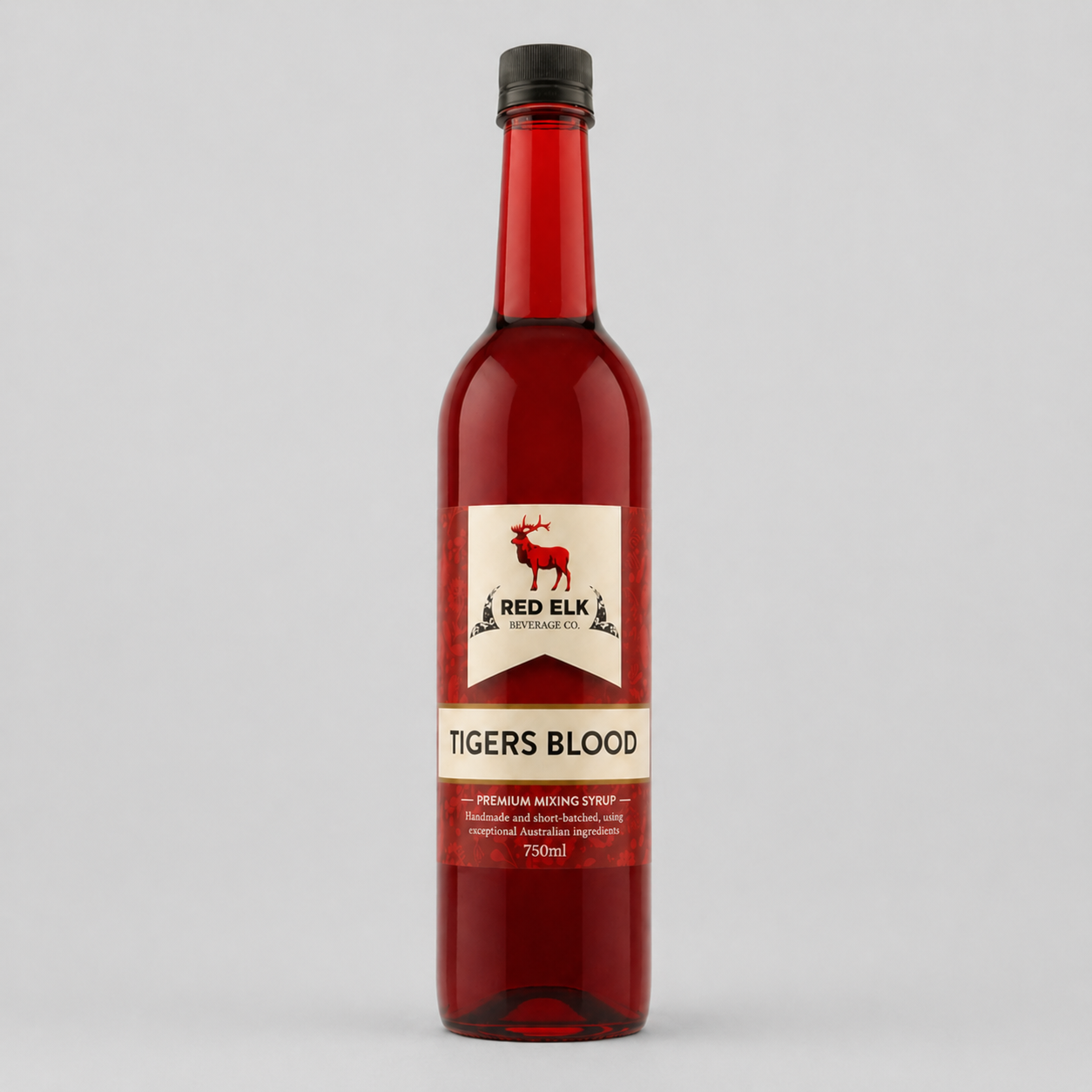 Bottle of Red Elk Tigers Blood syrup on a gray background